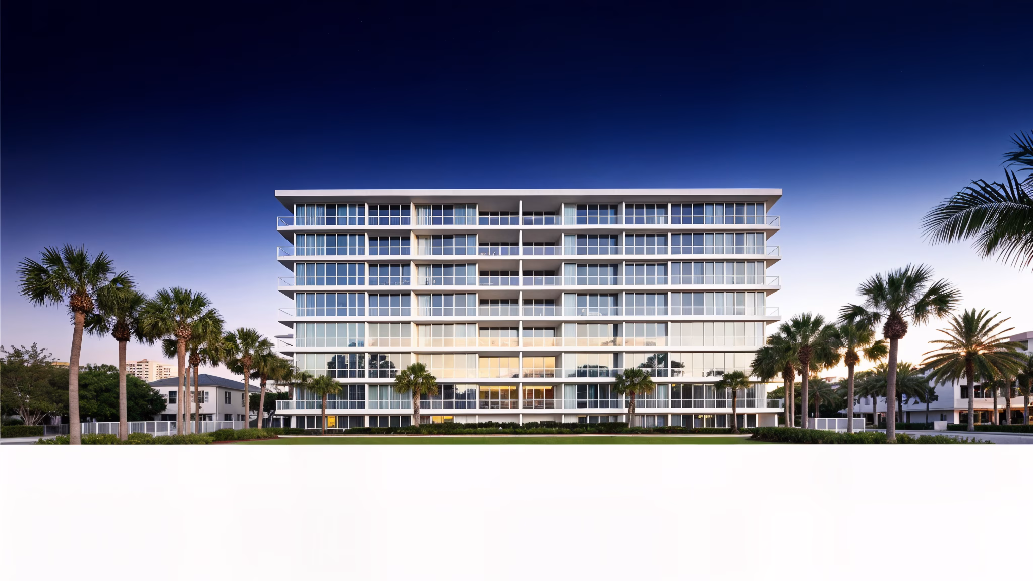 Modern Panama City Beach condominium building at dawn, clean white facade with palm trees, architectural photography
